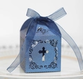 Macro view of blue laser-cut gift box with hollow cross and ribbon for religious events - Sapphire Blue