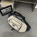 Vintage crossbody chest bag in cream and navy blue with adjustable elastic cord detail - Blue