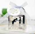Macro shot of silver hollowed wedding favor box with ribbon and floral thank you tag - Reflective Silver