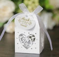 Detail of white laser-cut LOVE heart candy box with silk ribbon and golden thank you tag - White