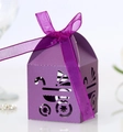Detail showing laser-cut purple baby carriage favor box with a matching ribbon bow - Dark Purple