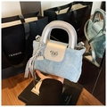 Detail of light blue denim mini bag with silver leather flap and heart-shaped metal lock - Silver (With Pendant)