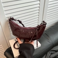 Fashionable burgundy glossy patent leather crescent shoulder bag with pleated details - Burgundy