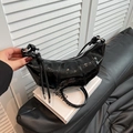 Minimalist black patent leather croissant bag with silver zipper and knotted strap - Black