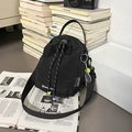 Black nylon bucket bag with drawstring closure and tennis racket charm accessory - With Charm / Black