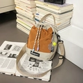 Crossbody bucket bag in orange and beige with tennis racket charm and shilaen label - With Charm / Khaki with Orange Sunflower