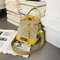 Crossbody drawstring bag in mustard yellow and taupe plaid with sporty tennis charm - With Charm / Yellow & Khaki