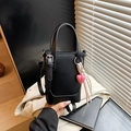 Black leather bucket bag with pink heart charm and striped ribbon, handheld style - Black with Pendant