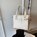 Chic off-white bucket bag with crocodile texture and adjustable shoulder strap - No Pendant / White