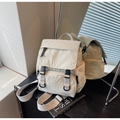 Close-up of off-white nylon canvas backpack with black plastic buckles and multi-pocket design - Off-white