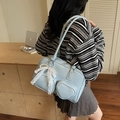 Light blue patent leather shoulder bag with heart pocket and pearl bow pendant - Blue