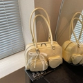 Creamy beige glossy leather Boston bag with heart pocket and pearl lace bow decoration - Yellow