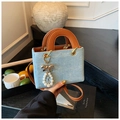 Light blue denim handbag with brown straps, textured dots and decorative pearl charm - With Charm / Sky Blue