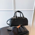 Black pebbled leather Boston bag with silver hardware and detachable crossbody strap - Black