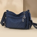 Quilted nylon crossbody bag in deep blue with multiple zipper compartments and wide strap - Navy Blue