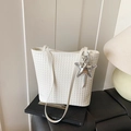 White woven tote bag with silver star charm and elegant shoulder straps for women - White
