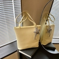Light yellow woven texture tote bag with dual straps and silver star charm detail - Yellow