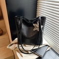 Black woven texture bucket bag with star and balloon dog charms for women - Black