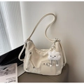 Close-up of beige hobo bag with adjustable strap, pocket detail and cloud charm - Off-white