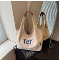 Détail du sac en toile beige avec poignées en cuir marron et broderie TCT bleue - Gris Beige