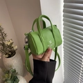Mini green barrel bag with litchi grain texture and adjustable shoulder strap - Green