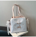 Close-up of pink tote bag with white polka dots, lace bows, and cute rabbit embroidery - Pink