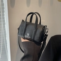 Mini black barrel crossbody bag with MISU & MADER logo and silver hardware detail - Black
