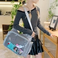 Chic gray ita bag with transparent PVC window and white strap shown in a cafe setting - Gray