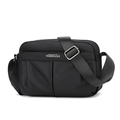 Close-up of black nylon crossbody bag featuring multiple zipper pockets and adjustable strap - Black