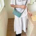 Minimalist turquoise crossbody bag with textured fabric and slim black leather strap - Blue (No Pendant)