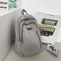 Sleek gray nylon backpack with water-resistant texture and multi-zipper pockets - Gray