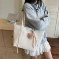 White stone textured tote bag with bear charm shown on model for daily commuting - Beige With Charm