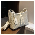 Detailed close-up of cream woven texture on a structured tote bag with metal base studs - Off White