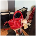 Detail of red crocodile pattern bucket bag with a cute plush bear charm and thin strap - Red with Pendant