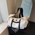 Minimalist white oxford fabric duffel bag with black straps and a stylish design - Off-white