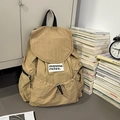 Khaki canvas backpack with drawstring closure and flap cover for casual travel use - Khaki