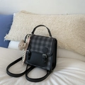 Detail of checkered mini backpack with faux leather straps and brown teddy bear charm - Black With Pendant