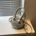 Silver round mini crossbody bag with litchi texture and double ring handles - Silver
