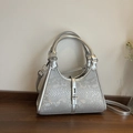 Silver bucket bag with snake skin pattern, metal clasp, and detachable shoulder strap - Silver