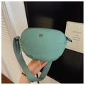 Close-up of mint green nylon crossbody bag with metal logo and adjustable strap - One Size / Green