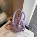 Minimalist round purple mini crossbody bag with litchi grain texture and top handle - Purple
