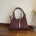 Burgundy bucket bag with snake skin pattern and silver metal piston clasp detail - Burgundy