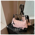 Pink jacquard baguette bag with black bow patterns and adjustable leather strap - Pink