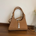 Brown faux snakeskin bucket bag with silver metal lock and adjustable shoulder strap - Brown