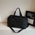 Large black matte waterproof travel duffel bag with handles and adjustable shoulder strap - Black