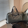 Olive green large capacity travel duffel bag with black straps and NOCOBAG logo - Green