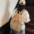 Minimalist beige nylon backpack with adjustable straps and front zip pocket - Khaki