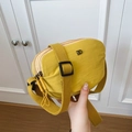 Chic mustard yellow nylon crossbody bag with adjustable wide strap and metal logo - Yellow