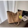 Minimalist beige canvas tote bag with yellow flower charm on a soft bench - Khaki with Pendant