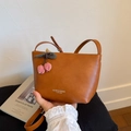 Brown leather crossbody tote bag with cherry charm and fashion text print design - Brown with Pendant